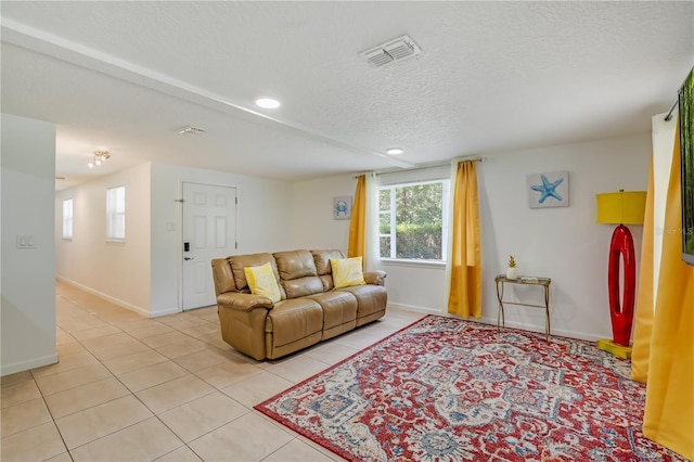 443 Polk Ave, Orange Park, FL 32065 - living area with light tile patterned flooring, baseboards, recessed lighting, and a textured ceiling