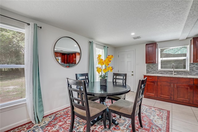 443 Polk Ave, Orange Park, FL 32065 - dining area featuring a textured ceiling, baseboards, light tile patterned flooring, and recessed lighting