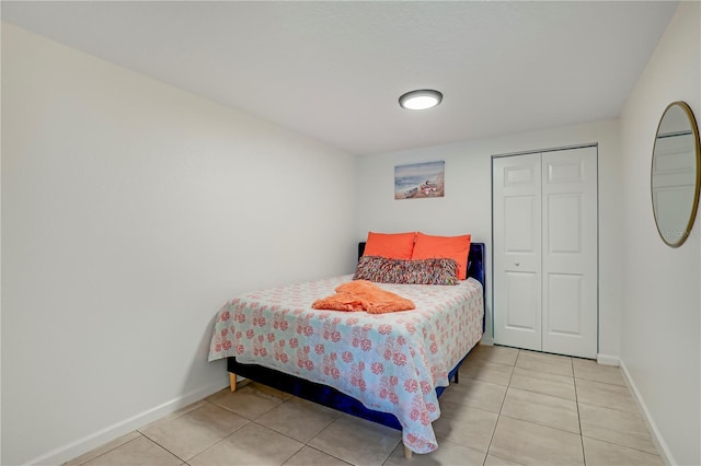 443 Polk Ave, Orange Park, FL 32065 - bedroom with light tile patterned floors, baseboards, and a closet