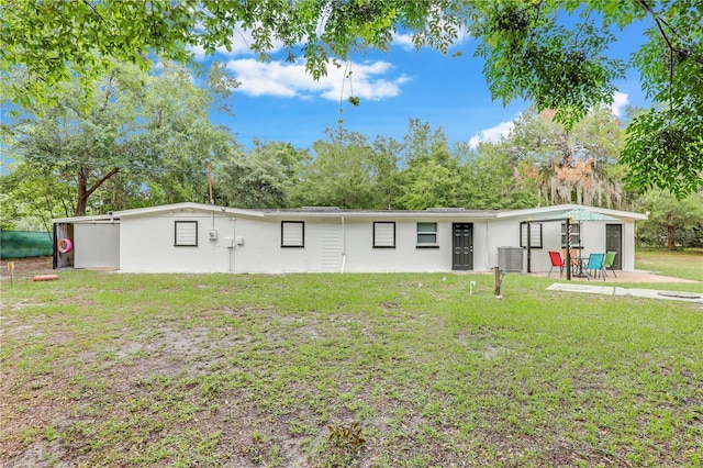 443 Polk Ave, Orange Park, FL 32065 - view of front facade with a front yard, stucco siding, and view of scattered trees