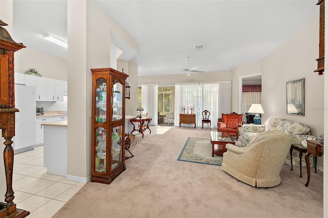 10 Chatham Pl Unit 10, Palm Coast, FL 32164 - living area with a ceiling fan, light colored carpet, and light tile patterned floors