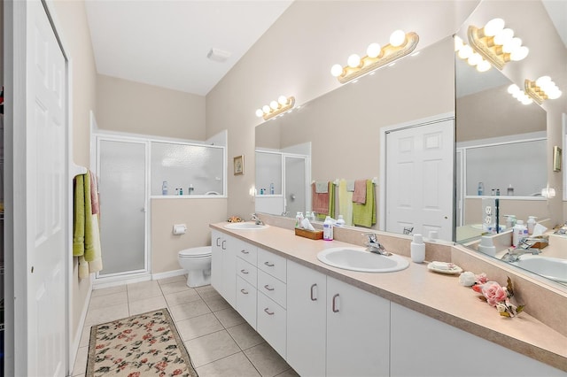 10 Chatham Pl Unit 10, Palm Coast, FL 32164 - full bathroom featuring double vanity, a shower stall, tile patterned floors, and toilet