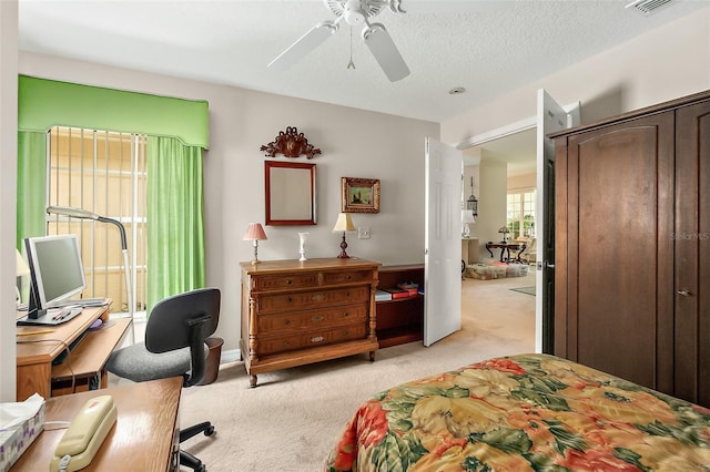 10 Chatham Pl Unit 10, Palm Coast, FL 32164 - bedroom featuring light carpet, a desk, a ceiling fan, and a closet