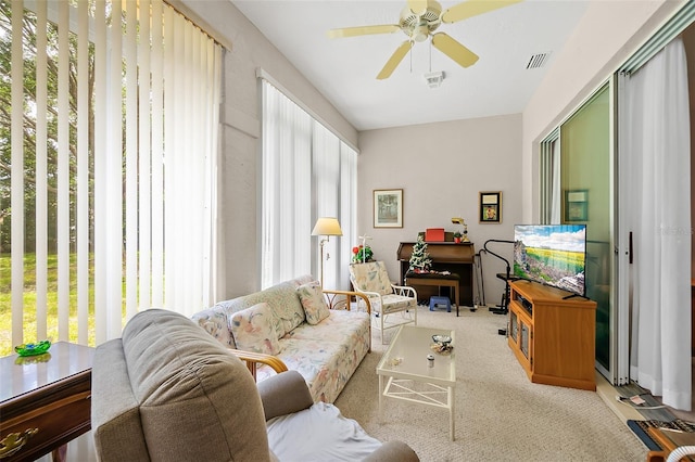 10 Chatham Pl Unit 10, Palm Coast, FL 32164 - living room with healthy amount of natural light, a ceiling fan, and carpet flooring