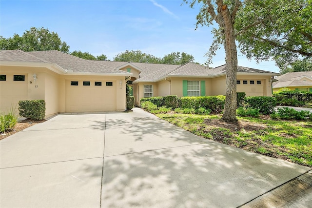 10 Chatham Pl Unit 10, Palm Coast, FL 32164 - ranch-style home with an attached garage, driveway, and stucco siding