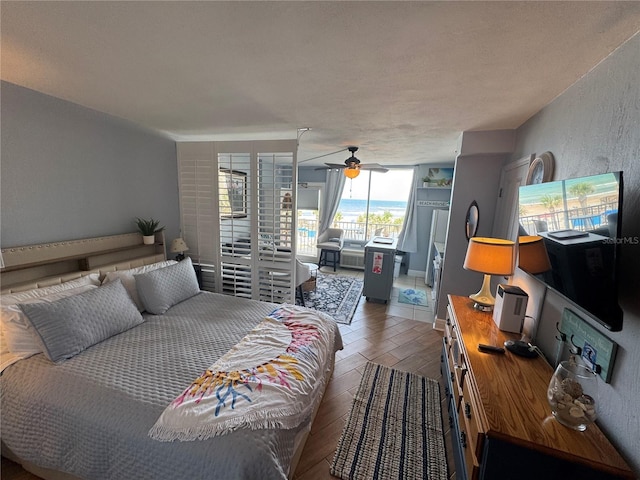 1233 S Atlantic Ave Unit 3070, Daytona Beach, FL 32118 - bedroom with access to exterior, wood finished floors, and a ceiling fan