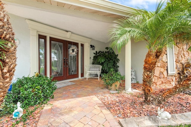 30 Clermont Ct, Palm Coast, FL 32137 - property entrance featuring french doors and stucco siding