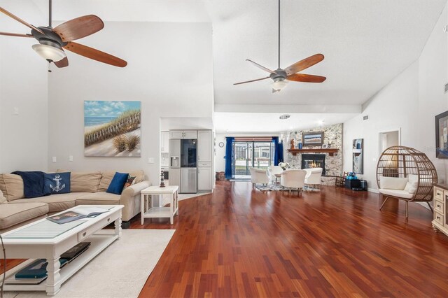 30 Clermont Ct, Palm Coast, FL 32137 - living area with a ceiling fan, wood finished floors, high vaulted ceiling, and a fireplace