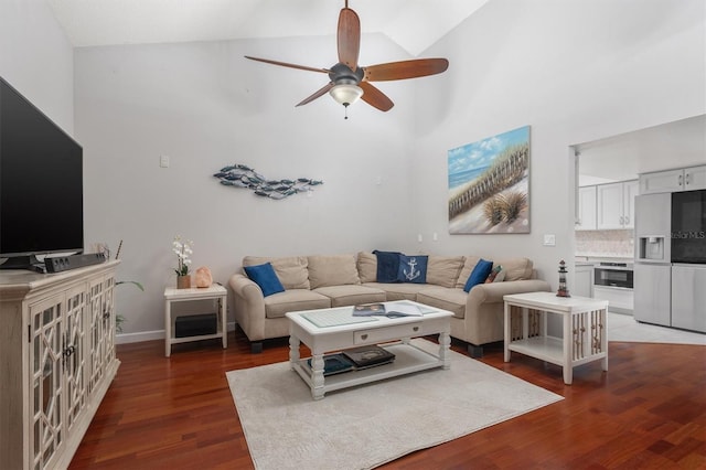 30 Clermont Ct, Palm Coast, FL 32137 - living room featuring a ceiling fan, dark wood-style flooring, high vaulted ceiling, and baseboards