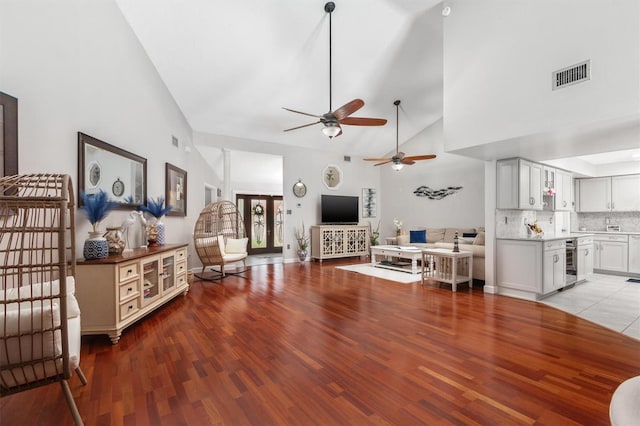 30 Clermont Ct, Palm Coast, FL 32137 - living room featuring wood finished floors, a ceiling fan, high vaulted ceiling, and wine cooler