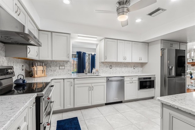 30 Clermont Ct, Palm Coast, FL 32137 - kitchen featuring stainless steel appliances, extractor fan, a sink, backsplash, and a ceiling fan