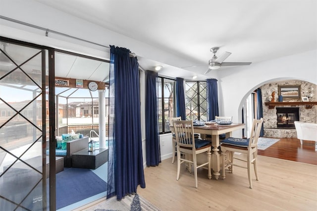 30 Clermont Ct, Palm Coast, FL 32137 - dining space featuring ceiling fan, wood finished floors, healthy amount of natural light, and a stone fireplace