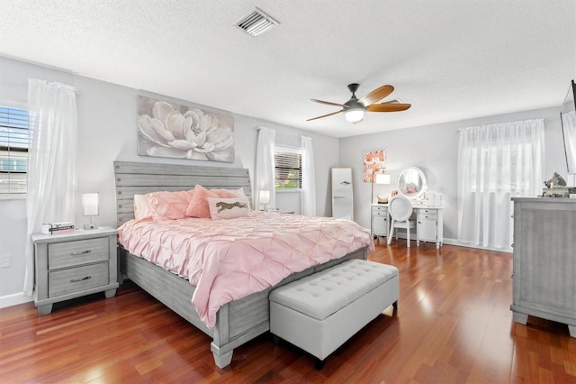 30 Clermont Ct, Palm Coast, FL 32137 - bedroom with wood finished floors, a textured ceiling, and ceiling fan