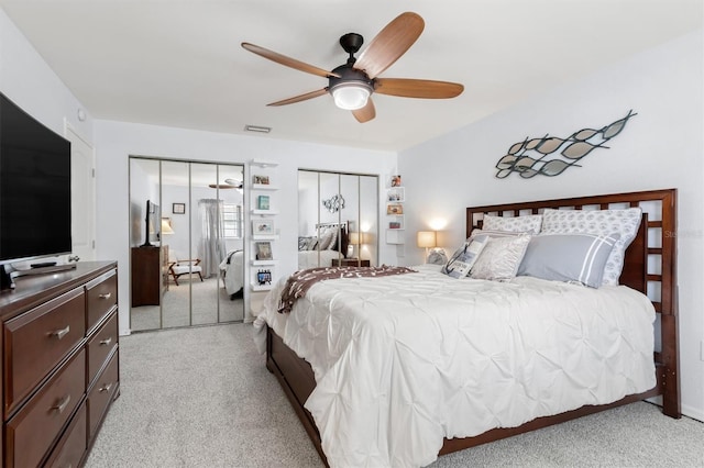 30 Clermont Ct, Palm Coast, FL 32137 - bedroom featuring light carpet, a ceiling fan, and two closets