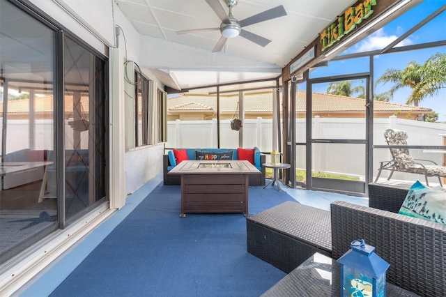 30 Clermont Ct, Palm Coast, FL 32137 - sunroom featuring a ceiling fan, lofted ceiling, and an outdoor living space with a fire pit