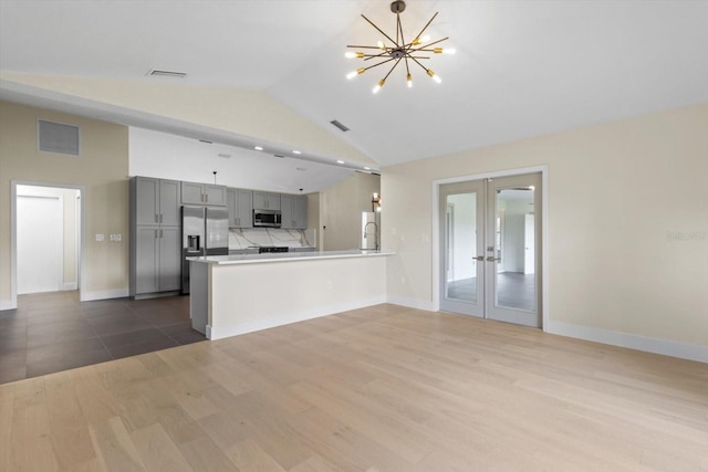 381 E Joplin Ct, Hernando, FL 34442 - kitchen featuring gray cabinets, stainless steel appliances, french doors, wood finished floors, and a peninsula