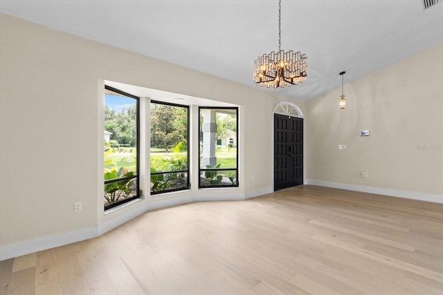 381 E Joplin Ct, Hernando, FL 34442 - empty room featuring a chandelier and wood finished floors