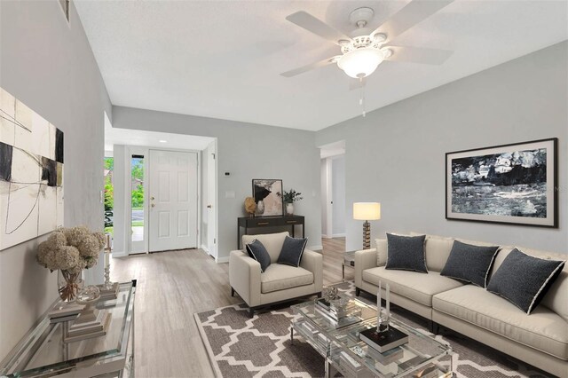 13 Hembury Ln, Palm Coast, FL 32137 - living room featuring light wood-type flooring, a ceiling fan, and baseboards