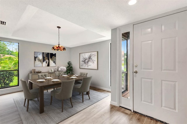 13 Hembury Ln, Palm Coast, FL 32137 - dining area featuring light wood finished floors, baseboards, recessed lighting, and a textured ceiling
