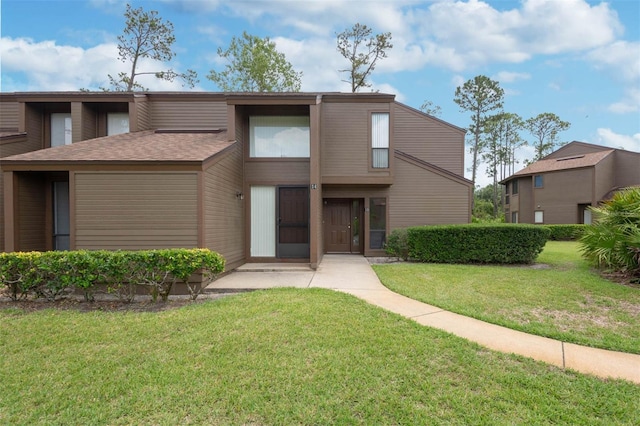 13 Hembury Ln, Palm Coast, FL 32137 - view of front of home featuring a front lawn
