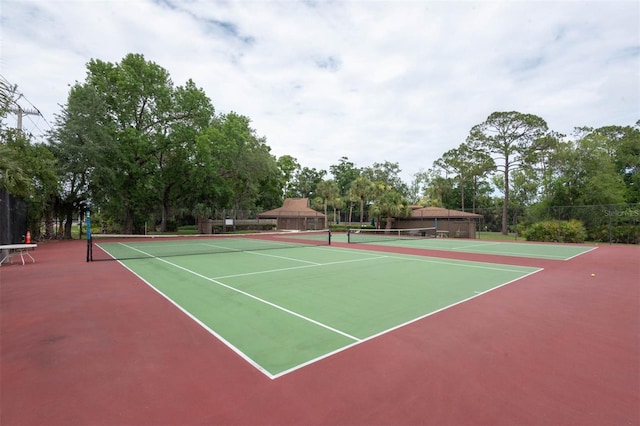 13 Hembury Ln, Palm Coast, FL 32137 - view of tennis court featuring community basketball court and view of scattered trees