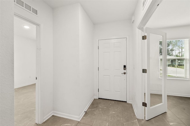 24 Beacon Mill Ln, Palm Coast, FL 32137 - tiled entrance foyer with baseboards