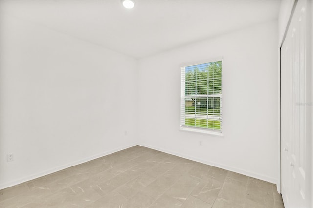 24 Beacon Mill Ln, Palm Coast, FL 32137 - spare room with baseboards