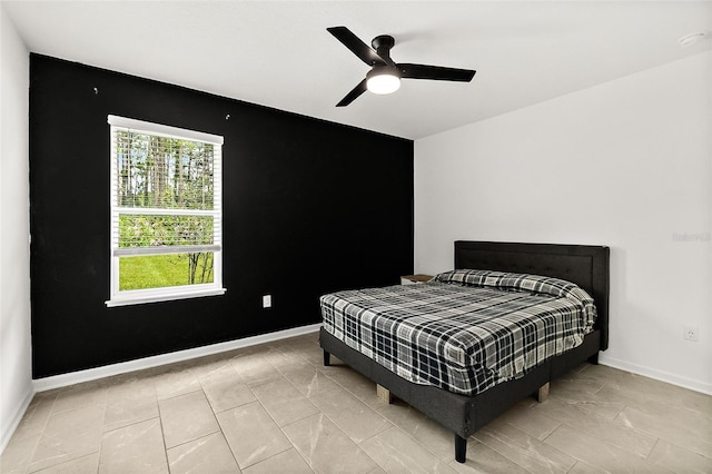 24 Beacon Mill Ln, Palm Coast, FL 32137 - bedroom with baseboards and a ceiling fan