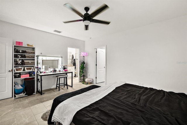 24 Beacon Mill Ln, Palm Coast, FL 32137 - bedroom with light tile patterned flooring, a ceiling fan, and connected bathroom