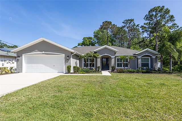 127 Wynnfield Dr, Palm Coast, FL 32164 - ranch-style home featuring an attached garage, a front lawn, concrete driveway, and stucco siding