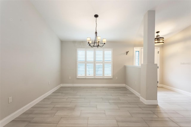 127 Wynnfield Dr, Palm Coast, FL 32164 - unfurnished room featuring a chandelier and baseboards