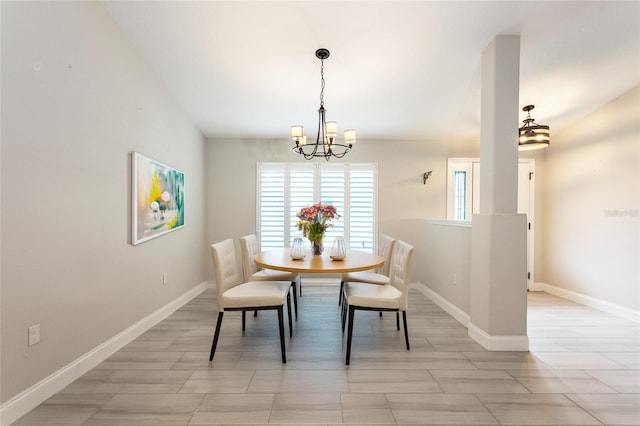 127 Wynnfield Dr, Palm Coast, FL 32164 - dining room featuring a chandelier and baseboards