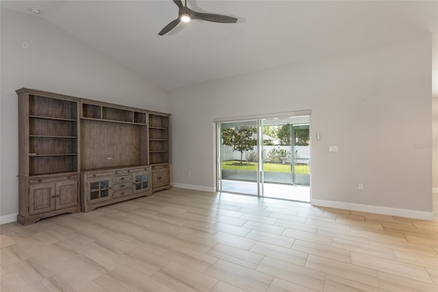 127 Wynnfield Dr, Palm Coast, FL 32164 - unfurnished living room with a ceiling fan, baseboards, high vaulted ceiling, and light wood-style floors