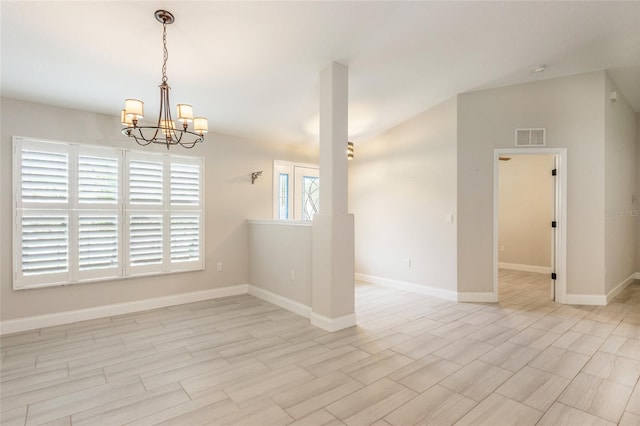 127 Wynnfield Dr, Palm Coast, FL 32164 - unfurnished room featuring a chandelier, baseboards, and vaulted ceiling