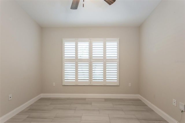 127 Wynnfield Dr, Palm Coast, FL 32164 - unfurnished room featuring ceiling fan and baseboards