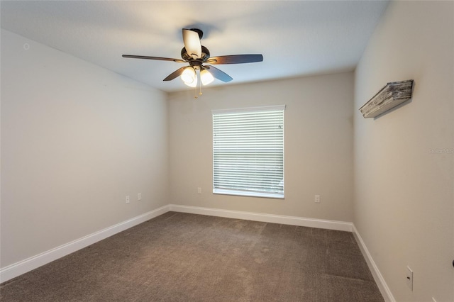 127 Wynnfield Dr, Palm Coast, FL 32164 - empty room featuring a ceiling fan, baseboards, and dark carpet