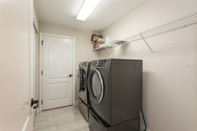 127 Wynnfield Dr, Palm Coast, FL 32164 - laundry room with independent washer and dryer and baseboards