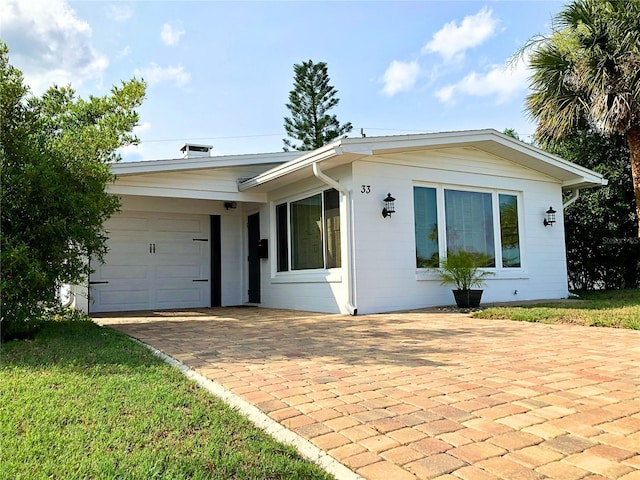 33 Camellia Dr, Ormond Beach, FL 32176 - single story home featuring a garage and driveway