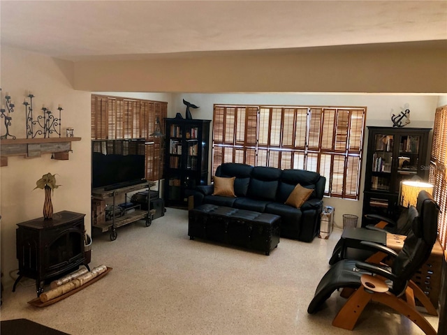 33 Camellia Dr, Ormond Beach, FL 32176 - living area with a wood stove and carpet flooring