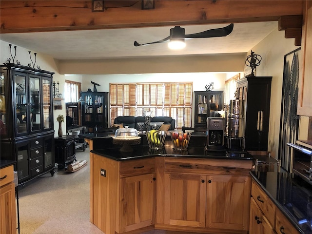 33 Camellia Dr, Ormond Beach, FL 32176 - kitchen with dark countertops, a ceiling fan, and brown cabinets