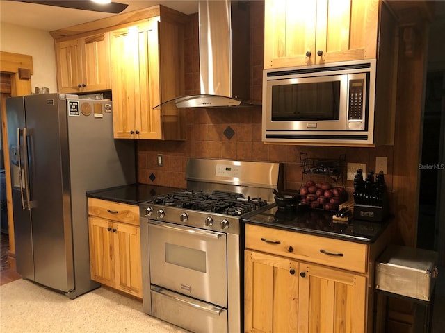 33 Camellia Dr, Ormond Beach, FL 32176 - kitchen featuring wall chimney range hood, appliances with stainless steel finishes, dark countertops, and backsplash