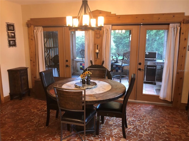 33 Camellia Dr, Ormond Beach, FL 32176 - dining room featuring french doors and a chandelier