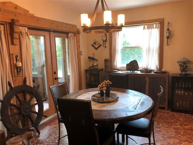 33 Camellia Dr, Ormond Beach, FL 32176 - dining area featuring a chandelier