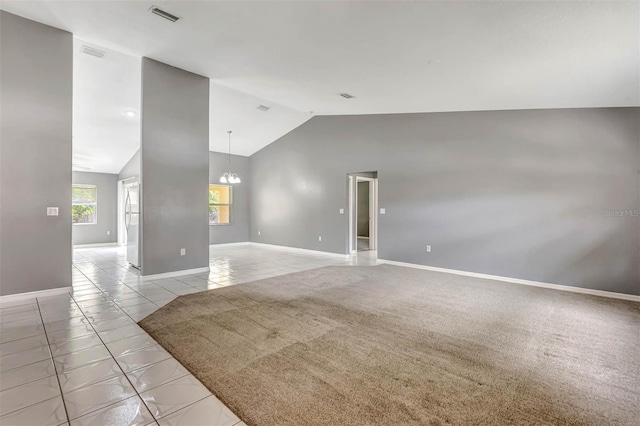 88 Pritchard Dr, Palm Coast, FL 32164 - empty room featuring lofted ceiling, a chandelier, and light tile patterned flooring