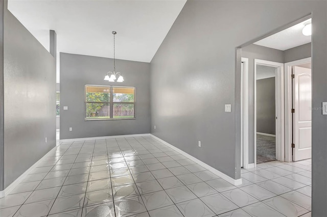 88 Pritchard Dr, Palm Coast, FL 32164 - spare room featuring light tile patterned floors, a chandelier, and high vaulted ceiling