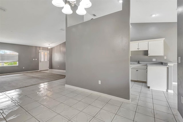 88 Pritchard Dr, Palm Coast, FL 32164 - unfurnished living room featuring light tile patterned flooring, a chandelier, and high vaulted ceiling