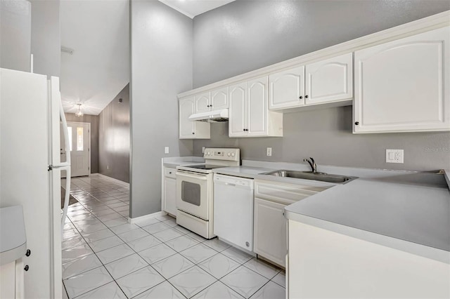 88 Pritchard Dr, Palm Coast, FL 32164 - kitchen featuring white appliances, under cabinet range hood, a towering ceiling, white cabinetry, and light tile patterned floors