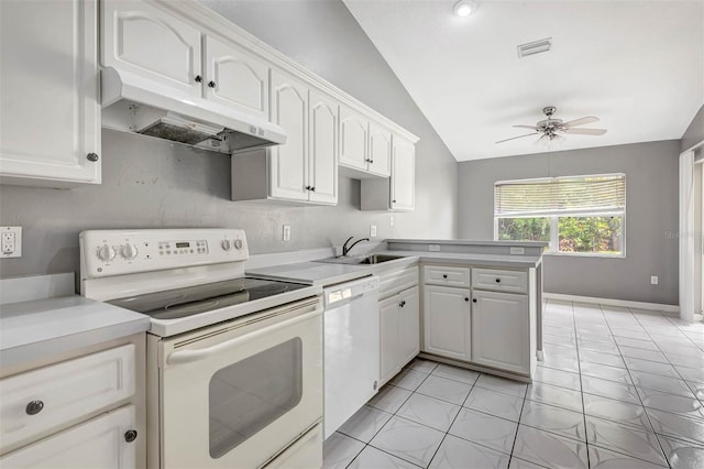 88 Pritchard Dr, Palm Coast, FL 32164 - kitchen featuring white appliances, under cabinet range hood, lofted ceiling, a peninsula, and white cabinetry