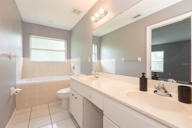 88 Pritchard Dr, Palm Coast, FL 32164 - full bath with a garden tub, tile patterned flooring, healthy amount of natural light, and double vanity