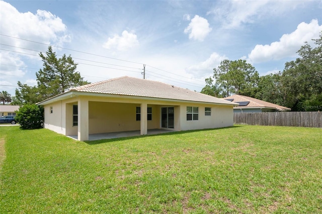 88 Pritchard Dr, Palm Coast, FL 32164 - back of property featuring a patio area, a tile roof, and stucco siding